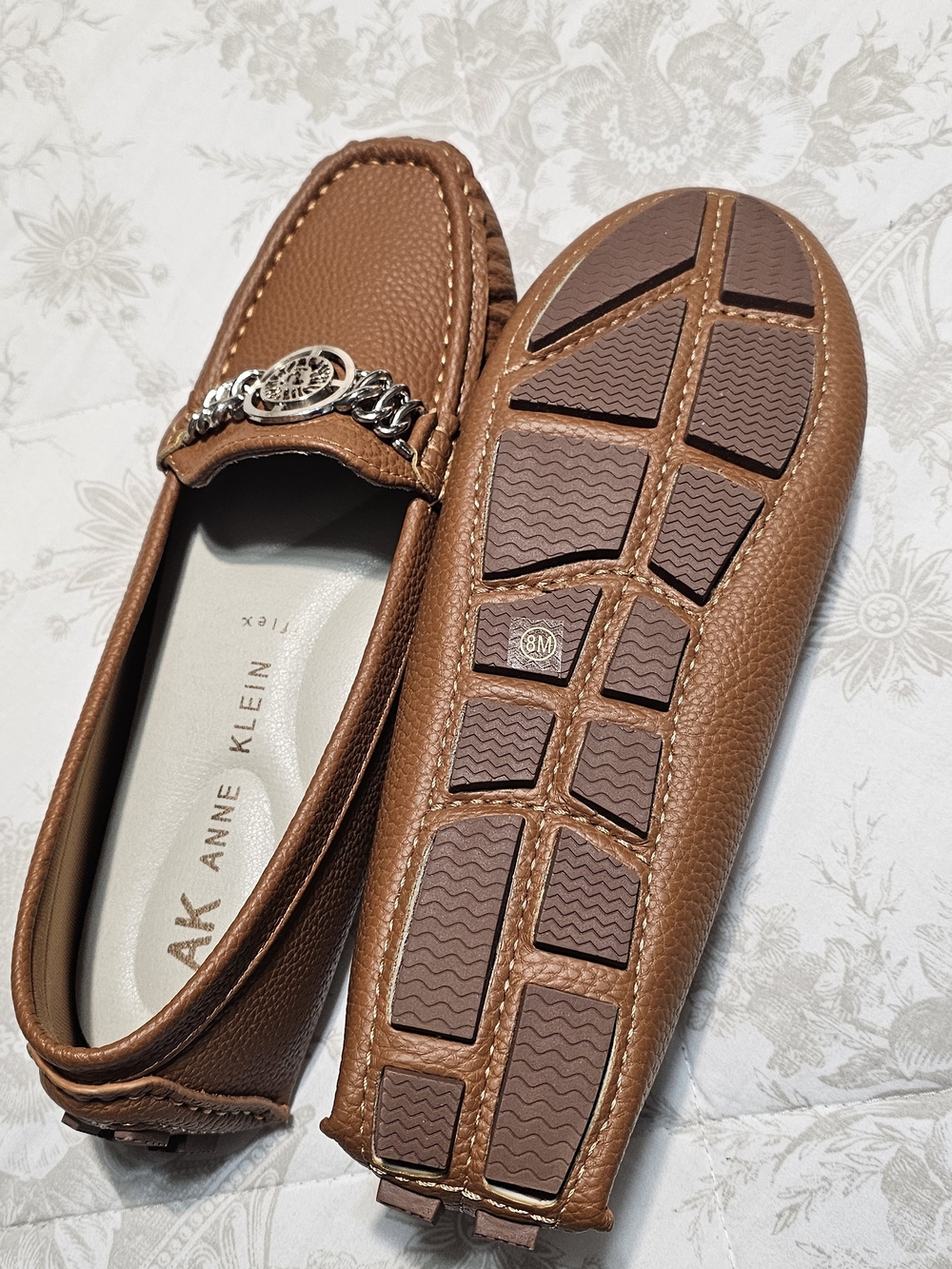 Anne Klein Woen’s Cognac Brown Pebbled Leather Slip-On Loafers with Chain Accent